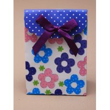 Super MINI fold flat gift box with velcro fastener and flower print with ribbon detail.